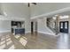 Living room with staircase, and an entrance view of a kitchen at 2118 Town Manor Ct, Dacula, GA 30019