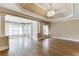Spacious living room features coffered ceilings, hardwood floors, and plenty of natural light at 2118 Town Manor Ct, Dacula, GA 30019