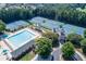 A luxurious community pool with tennis courts, well-maintained landscaping and a charming clubhouse at 2118 Town Manor Ct, Dacula, GA 30019