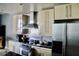 Modern kitchen with stainless steel appliances, sleek countertops, and contemporary cabinetry at 250 Park Avenue West # 802, Atlanta, GA 30313