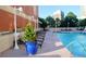 Inviting pool area with comfortable lounge chairs and a view of the city skyline at 250 Park Avenue West # 802, Atlanta, GA 30313