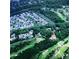 Aerial view of golf course neighborhood with lush landscaping, ponds and beautiful homes at 9325 Saint Georgen Cmn, Duluth, GA 30097