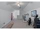 Bonus room with sloped ceilings being used as an exercise room at 9325 Saint Georgen Cmn, Duluth, GA 30097