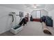 Bonus room with sloped ceilings being used as an exercise room at 9325 Saint Georgen Cmn, Duluth, GA 30097