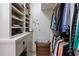 Well-organized walk-in closet with ample space for shoes, accessories, and hanging clothes at 9325 Saint Georgen Cmn, Duluth, GA 30097