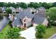 Beautiful two-story brick home with well-maintained landscaping on a scenic lake lot at 9325 Saint Georgen Cmn, Duluth, GA 30097