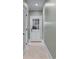 Hallway featuring a back door with glass panes and tile flooring at 9325 Saint Georgen Cmn, Duluth, GA 30097