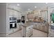 Gourmet kitchen with custom cabinets, granite countertops, stainless steel appliances at 9325 Saint Georgen Cmn, Duluth, GA 30097
