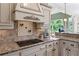 Updated kitchen with granite countertops, decorative backsplash, and stainless steel appliances at 9325 Saint Georgen Cmn, Duluth, GA 30097