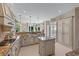 Open kitchen with stone countertops, stainless appliances, kitchen island and views of the outside at 9325 Saint Georgen Cmn, Duluth, GA 30097