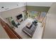 Open concept living room with fireplace, high ceilings, and large windows allowing for plenty of natural light at 9325 Saint Georgen Cmn, Duluth, GA 30097