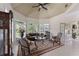 Bright living room with large windows, custom shutters, neutral decor, and elegant furnishings at 9325 Saint Georgen Cmn, Duluth, GA 30097