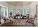 Elegant living room with abundant natural light, custom shutters, stylish furniture, and neutral color palette at 9325 Saint Georgen Cmn, Duluth, GA 30097