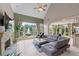 Bright living room with vaulted ceilings, stone fireplace, tile floors, and water views at 9325 Saint Georgen Cmn, Duluth, GA 30097