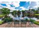 Scenic backyard pond view with lush landscaping and fountain at 9325 Saint Georgen Cmn, Duluth, GA 30097