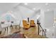 Finished attic space with hardwood floors, dormer windows, and cozy seating areas at 1774 Vesta Ave, Atlanta, GA 30337