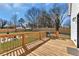 Back deck featuring a grill, dining set, and stairs leading down to a private backyard at 1774 Vesta Ave, Atlanta, GA 30337