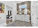 Stunning bathroom with double vanity, decorative wallpaper, and a view into the Primary bedroom at 1774 Vesta Ave, Atlanta, GA 30337