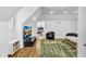 Bright bedroom featuring a modern design, wooden floors, and a sleek TV set for entertainment at 1774 Vesta Ave, Atlanta, GA 30337