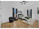 Comfortable bedroom with hardwood floors, chair, and plush bed with natural light at 1774 Vesta Ave, Atlanta, GA 30337