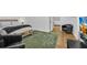 Well-lit bedroom featuring a seating area, a TV for entertainment, and modern decor at 1774 Vesta Ave, Atlanta, GA 30337