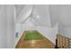 Bright bonus room features a sloped ceiling, hardwood floors and fun games for entertainment at 1774 Vesta Ave, Atlanta, GA 30337
