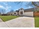 Charming home boasting a spacious driveway and well-maintained landscaping at 1774 Vesta Ave, Atlanta, GA 30337