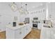 Bright kitchen with a marble island, stainless appliances, and pendant lighting at 1774 Vesta Ave, Atlanta, GA 30337