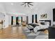 Bright and airy main bedroom featuring neutral tones, hardwood floors, and stylish furnishings at 1774 Vesta Ave, Atlanta, GA 30337