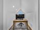 Bright home office with modern computer, wooden desk, and a unique, airy space at 1774 Vesta Ave, Atlanta, GA 30337