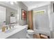 Neutral bathroom features white tiled walls and a shower-tub combination with beige accents at 2743 Long Grove Dr, Marietta, GA 30062