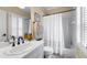 Bathroom featuring a shower-tub, toilet, white vanity and plantation shutters for natural light at 2743 Long Grove Dr, Marietta, GA 30062