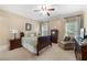 Cozy bedroom featuring neutral colored walls, carpet, soft lighting, and comfortable armchair at 2743 Long Grove Dr, Marietta, GA 30062