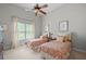 Bright bedroom with two twin beds, neutral decor, and ample natural light creating a serene atmosphere at 2743 Long Grove Dr, Marietta, GA 30062