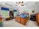 Colorful bedroom featuring a wooden bed, a ceiling fan, and built-in shelving for storage at 2743 Long Grove Dr, Marietta, GA 30062