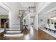 Elegant foyer with a grand staircase, hardwood floors, and tasteful decor, creating a welcoming entrance at 2743 Long Grove Dr, Marietta, GA 30062