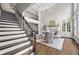 Grand foyer with staircase, hardwood floors, a fireplace, and large windows at 2743 Long Grove Dr, Marietta, GA 30062