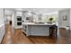 Spacious kitchen with a large island, modern appliances, and hardwood floors at 2743 Long Grove Dr, Marietta, GA 30062