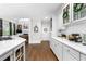 Bright kitchen featuring white cabinets, subway tile backsplash, and stainless steel appliances at 2743 Long Grove Dr, Marietta, GA 30062