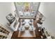 A birds eye view of a gorgeous living room featuring soaring ceilings, hardwood floors, fireplace and outdoor access at 2743 Long Grove Dr, Marietta, GA 30062