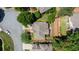 A stunning aerial view captures the house's roof, surrounding trees, and a driveway at 4648 Glenshire Pl, Atlanta, GA 30338
