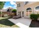 An outdoor patio features stylish seating and a door that leads into a charming, neutral-toned home at 4648 Glenshire Pl, Atlanta, GA 30338