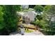 Aerial shot of the house overlooking the well-maintained backyard, patio, and lush landscaping at 4648 Glenshire Pl, Atlanta, GA 30338