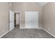 Neutral bedroom with plush carpet, high ceilings, a double closet, and ample natural light at 4648 Glenshire Pl, Atlanta, GA 30338