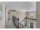 Upstairs hallway with decorative railing and window views at 4648 Glenshire Pl, Atlanta, GA 30338