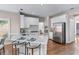 Modern kitchen features quartz countertops, stainless steel appliances and hardwood floors at 4648 Glenshire Pl, Atlanta, GA 30338
