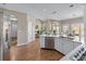 Open concept kitchen with white cabinets, stainless steel appliances, and hardwood floors at 4648 Glenshire Pl, Atlanta, GA 30338