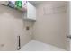 The bright laundry room includes shelving and a utility sink hookup for added convenience at 4648 Glenshire Pl, Atlanta, GA 30338
