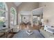 Open floor plan with hardwood floors connecting the living area to the dining and kitchen spaces at 4648 Glenshire Pl, Atlanta, GA 30338