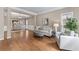 Cozy living room with hardwood floors, neutral tones, and comfortable seating at 4648 Glenshire Pl, Atlanta, GA 30338